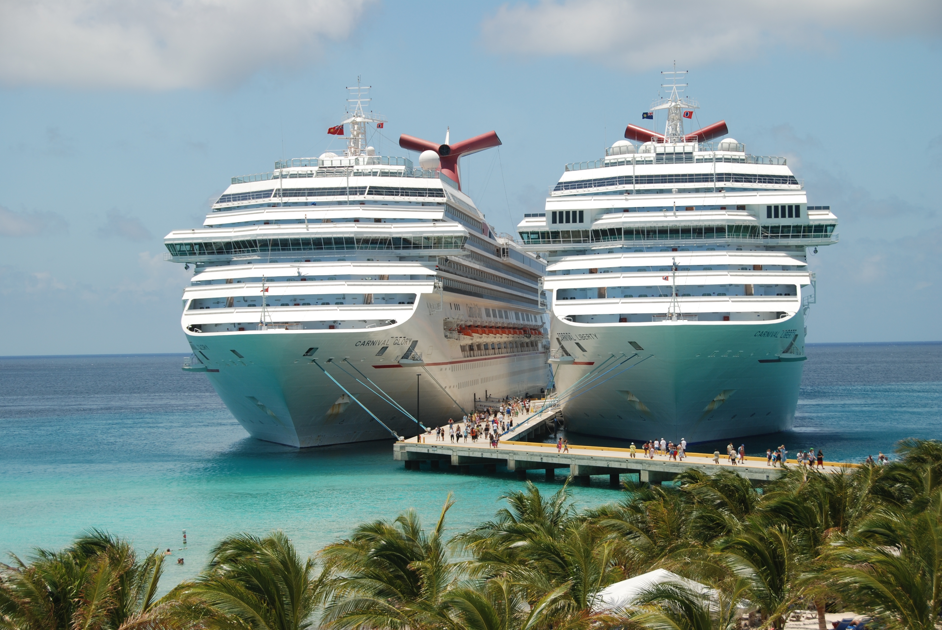 two carnival cruise ships docked in grand turk cruise terminal