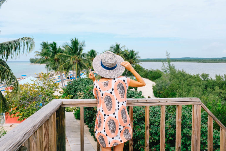 Drea looking towards beach in patterned dress