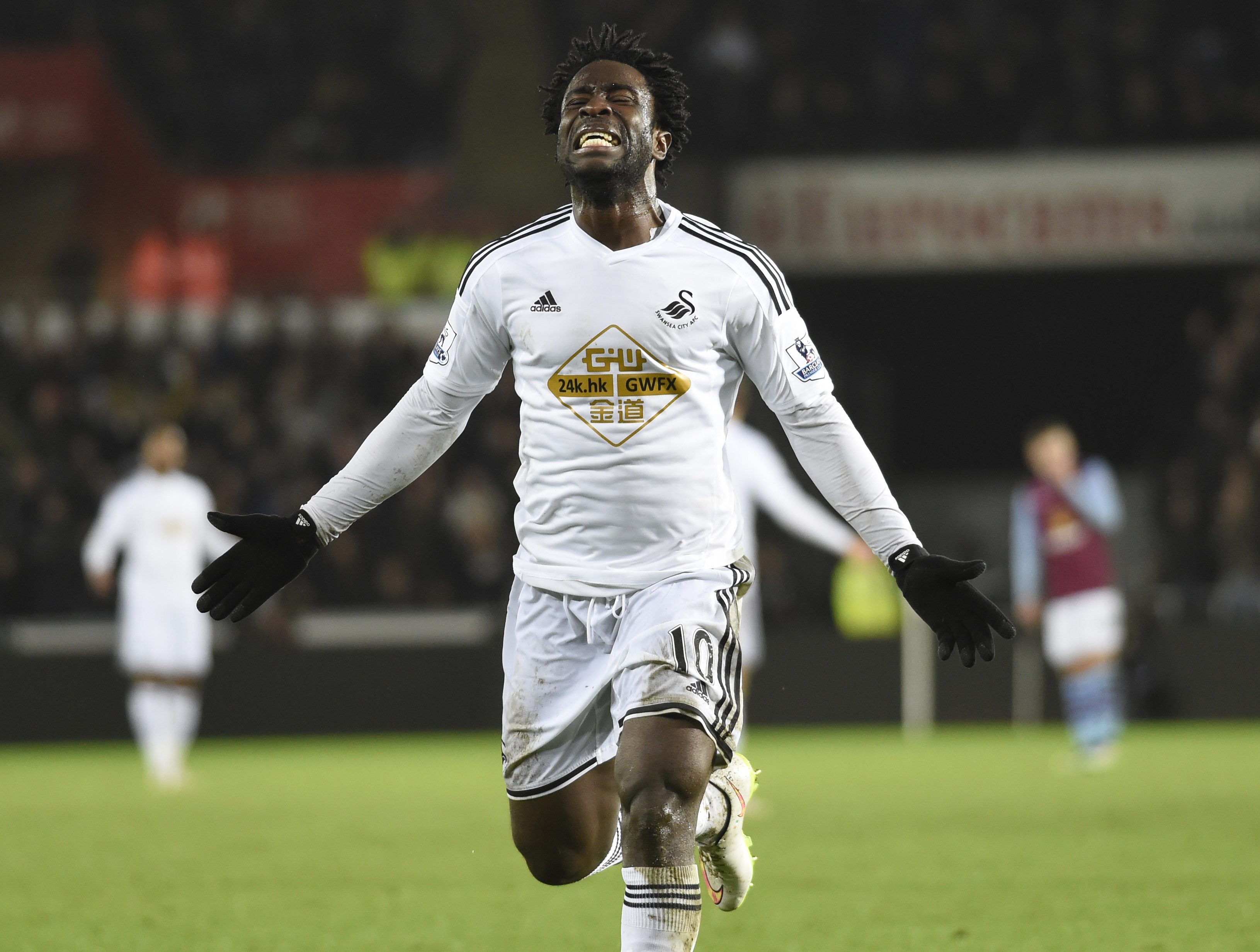 Swansea City's Wilfried Bony celebrates scoring a goal, that was later disallowed, during their English Premier League soccer match at the Liberty Stadium in Swansea