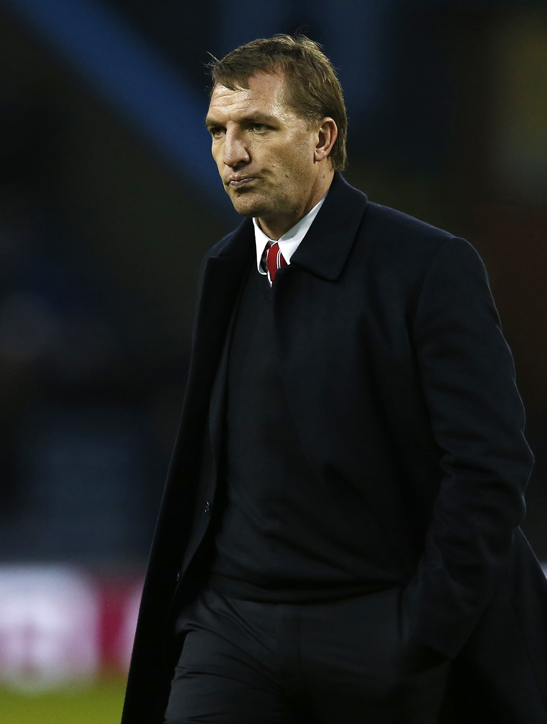 Liverpool manager Brendan Rodgers leaves the pitch at half time during their English Premier League soccer match against Burnley at Turf Moor in Burnley