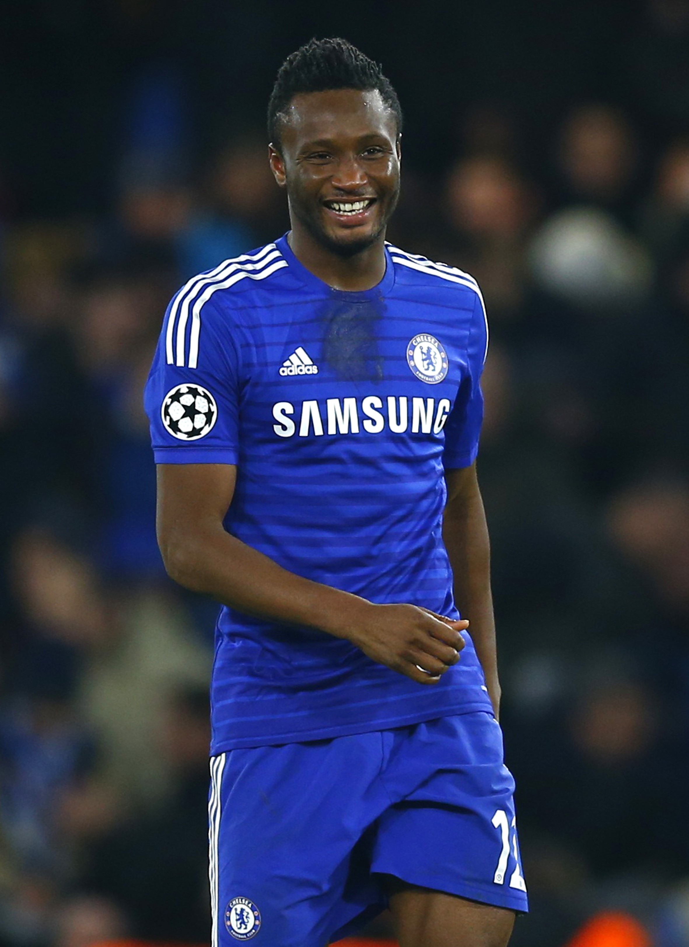 Chelsea's John Obi Mikel smiles after scoring a goal against Sporting during their Champions League soccer match in London